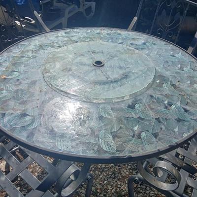 Martha Stewart patio table with etched glass and lazy susan comes with 5 metal chairs and weighted umbrella stand