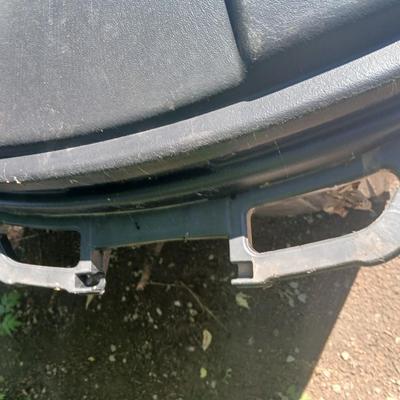 Large rolling back trash can and a blue recycle rolling bin