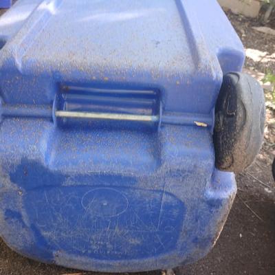 Large rolling back trash can and a blue recycle rolling bin