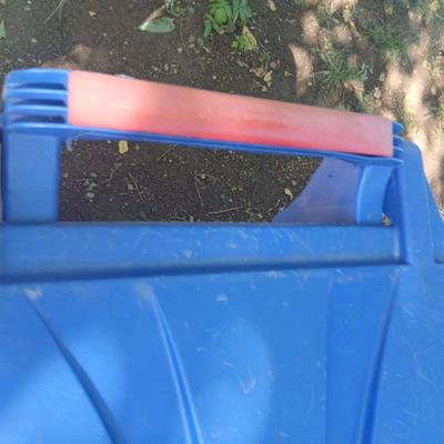 Large rolling back trash can and a blue recycle rolling bin