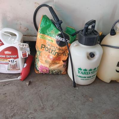 Ortho Home defense insect killer with two-yard weed sprayers and a partial bag of potting soil