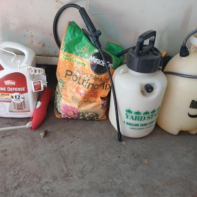 Ortho Home defense insect killer with two-yard weed sprayers and a partial bag of potting soil