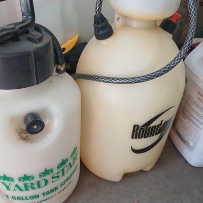 Ortho Home defense insect killer with two-yard weed sprayers and a partial bag of potting soil