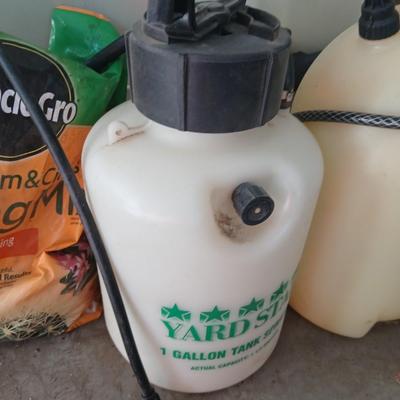 Ortho Home defense insect killer with two-yard weed sprayers and a partial bag of potting soil