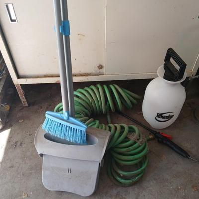 Garden hose, garden sprayer and a small broom with dustpan
