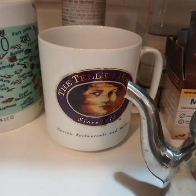 Keurig coffee pot with coffee mugs and other accessories