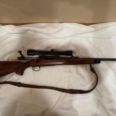 Sale Photo Thumbnail #27: Remington Model 700. 243 WIN with a 21 inch barrel and a Tasco 4x32 scope. This one will need a good cleaning as it is dusty.