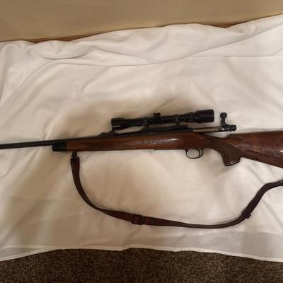 Sale Photo Thumbnail #24: Remington Model 700. 243 WIN with a 21 inch barrel and a Tasco 4x32 scope. This one will need a good cleaning as it is dusty.