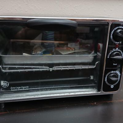 Toaster oven Model A3430CJ with an assortment of thermometers