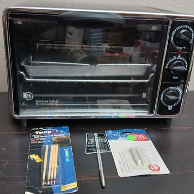 Toaster oven Model A3430CJ with an assortment of thermometers