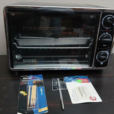 Toaster oven Model A3430CJ with an assortment of thermometers