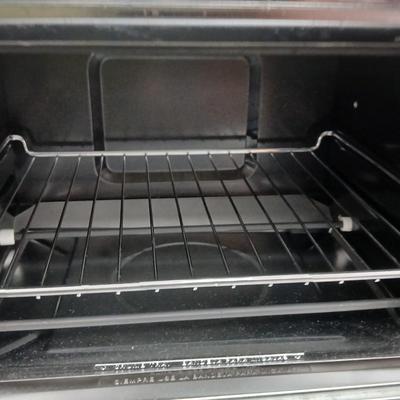 Toaster oven Model A3430CJ with an assortment of thermometers