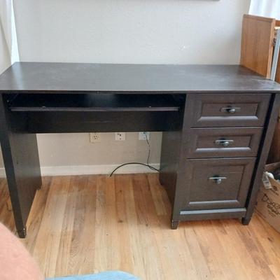 Small black student desk with keyboard tray and three drawers - full of office supplies!!