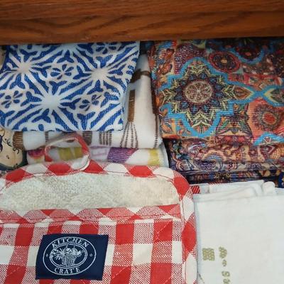 Kitchen towels - hot pads - coasters - and refrigerator magnets