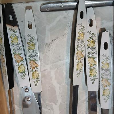 Drawer organizer full of assorted mis-matched flatware and a nice utensil set
