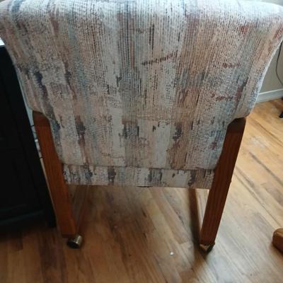 Oak diningroom table with claw foot base - 4 fabric covered chairs and two table leafs.
