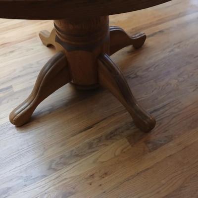 Oak diningroom table with claw foot base - 4 fabric covered chairs and two table leafs.