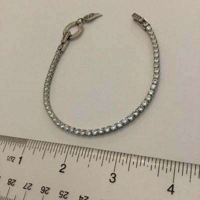 Beautiful vintage watch over me tennis bracelet. Crystal rhinestone angel wing charm very nice very beautiful.