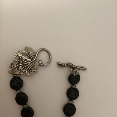 Black stone necklace with large leaf pendant