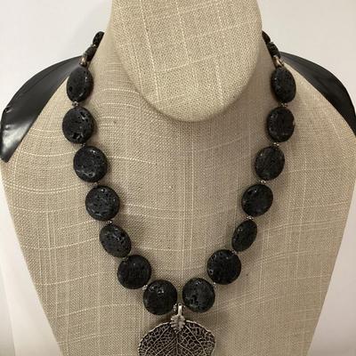 Black stone necklace with large leaf pendant