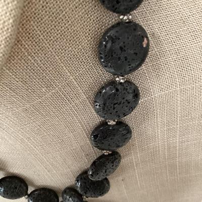 Black stone necklace with large leaf pendant