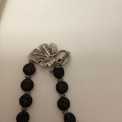 Black stone necklace with large leaf pendant