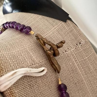 Purple and gold tone beaded necklace