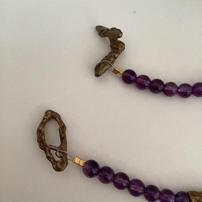 Purple and gold tone beaded necklace
