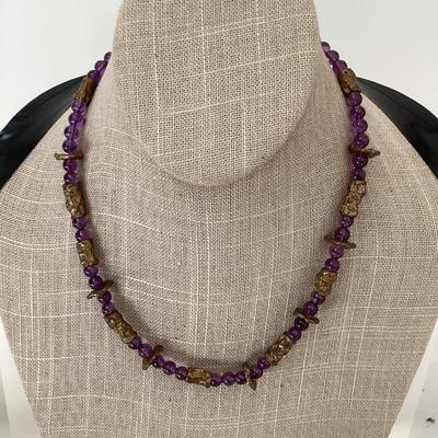 Purple and gold tone beaded necklace