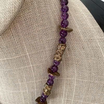 Purple and gold tone beaded necklace