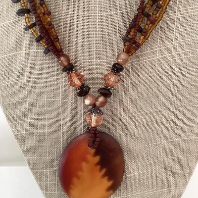 Vintage orange and brown multi strand necklace with large pendant and earrings