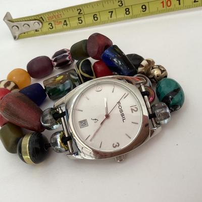 Fossil women’s wrist watch and blue floral earrings