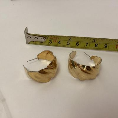Gold tone curved earrings
