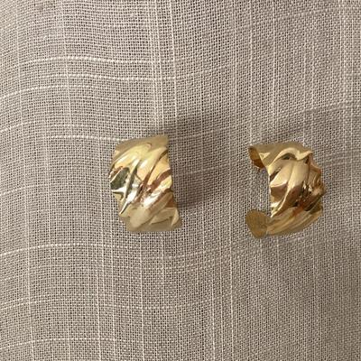 Gold tone curved earrings