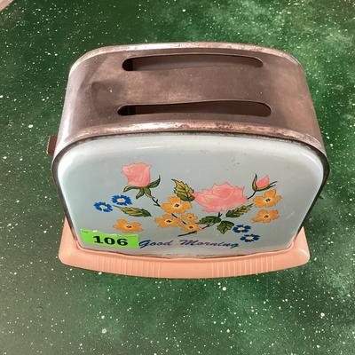 vintage toy toaster with flower detail