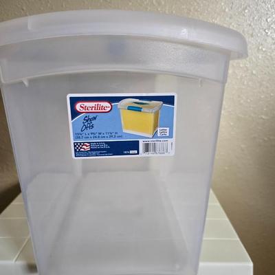 small lidded totes - and a small laundry or storage basket