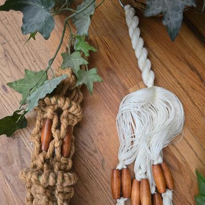 Two Faux plants with two macramé plant hangers