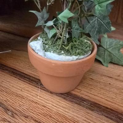 Two Faux plants with two macramé plant hangers