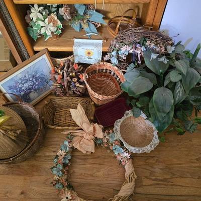 Large lot of wicker baskets, a faux plant, wall art and more