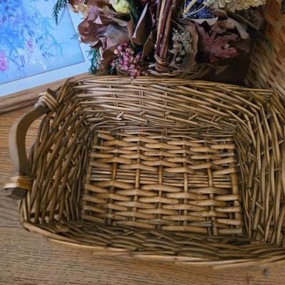 Large lot of wicker baskets, a faux plant, wall art and more