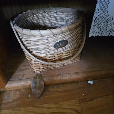 Large lot of wicker baskets, a faux plant, wall art and more