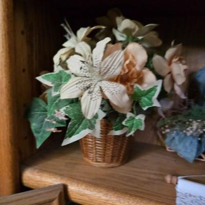 Large lot of wicker baskets, a faux plant, wall art and more