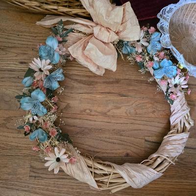 Large lot of wicker baskets, a faux plant, wall art and more