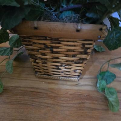 Large lot of wicker baskets, a faux plant, wall art and more