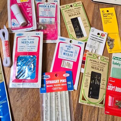 New old stock sewing notions - old needles with neat graphics -zippers - buttons- Vintage 1948 Singer Buttonholer and more