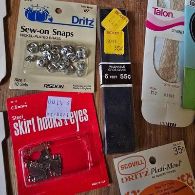 New old stock sewing notions - old needles with neat graphics -zippers - buttons- Vintage 1948 Singer Buttonholer and more