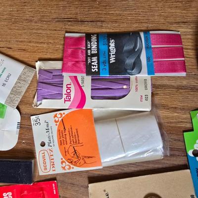 New old stock sewing notions - old needles with neat graphics -zippers - buttons- Vintage 1948 Singer Buttonholer and more