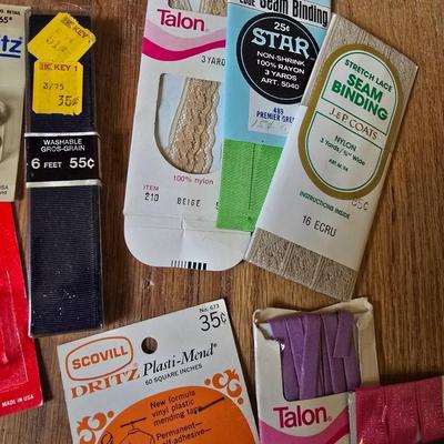 New old stock sewing notions - old needles with neat graphics -zippers - buttons- Vintage 1948 Singer Buttonholer and more