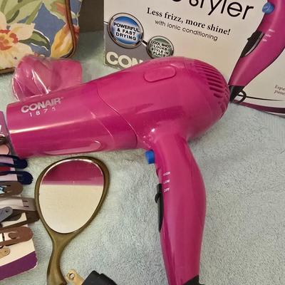 Bathroom scale - curling irons - hairdryer - and an assortment of other beauty products