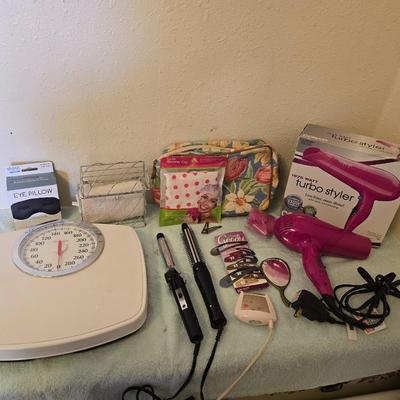 Bathroom scale - curling irons - hairdryer - and an assortment of other beauty products